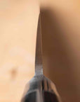 Close-up of a knife blade on a blurred background