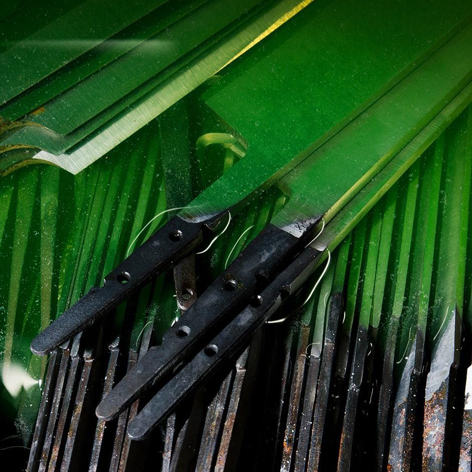 A collection of hand-finished Japanese kitchen knives with sleek blades and traditional craftsmanship.